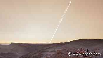 The moon photobombs a sunset in this otherworldly solar eclipse image