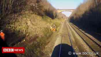 Rail workers narrowly avoided being hit by 95mph train