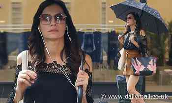 Famke Janssen cuts a stylish figure in a brown leather miniskirt on a stroll in New York City - Daily Mail