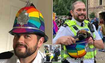 Is this Britain's wokest cop? Cambridge superintendent pictured wearing rainbow helmet on patrol