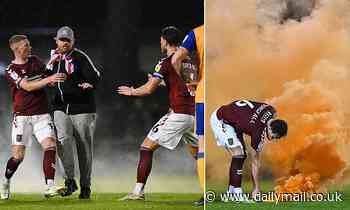 Northampton fans invade pitch after League Two playoff defeat and 'throw flare at Mansfield players'