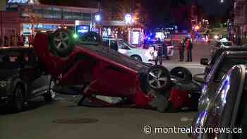 Car flips over after colliding with taxi on Sainte-Catherine Street - CTV News Montreal