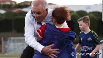 Australian PM collides with child in soccer match - CNN