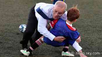 Australian PM Scott Morrison accidentally rugby tackles boy during football match at election event - Sky News