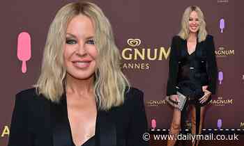 Kylie Minogue puts on a leggy display in a racy black bandage dress during Cannes event