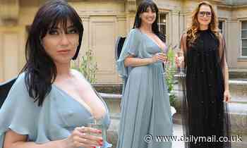 Daisy Lowe puts her ample assets on display in a plunging teal dress as she steps out for dinner