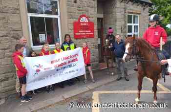 Ribble Valley MP sees baton delivered to primary school