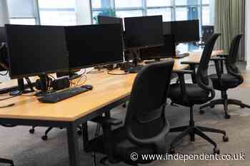 Government staff work in corridors over desks shortage