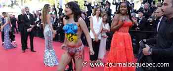 [PHOTOS] Une femme dénonce les viols russes en Ukraine sur le tapis rouge de Cannes