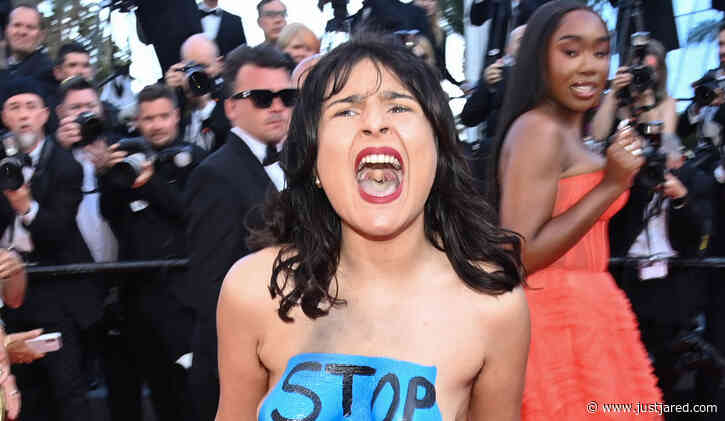 Topless Protester Storms the Red Carpet at Cannes 2022 Premiere - See Photos