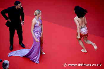 Protesters hit Cannes red carpet to condemn femicide, smoke bombs used to attract attention