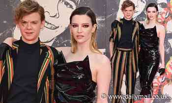 Talulah Riley poses with dapper beau Thomas Brodie-Sangster at London