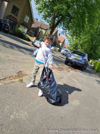Charles, six, cleans up his town
