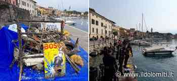 Più di 50 sommozzatori per ripulire il lago di Garda, Modina: "Ritrovato un cartello degli anni '50 della Bosch che promuove le candele delle auto" - il Dolomiti