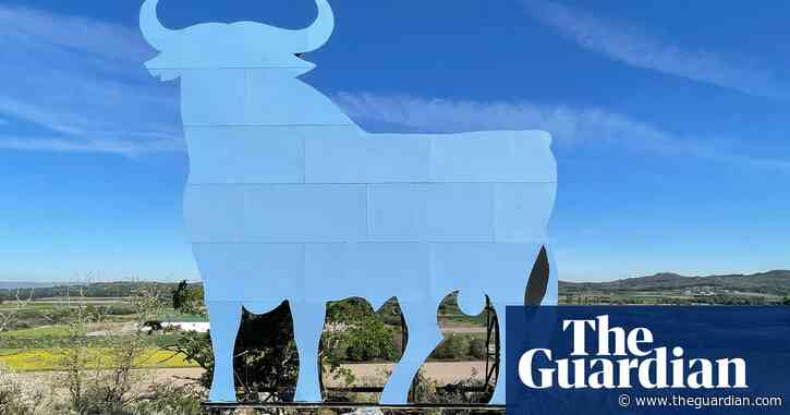Cow you see me, cow you don’t: Spanish town’s Osborne bull turns sky blue