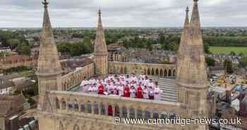 Girls join annual Ascension Day choir on Cambridge college tower for first time ever