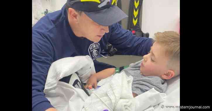 Boy Gets Stuck in Tube Slide and Breaks Arm: Firefighter Climbs in to Comfort Him While He's Treated