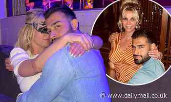 Britney Spears covers her eyes with a mask as she parties with fiancé Sam Asghari