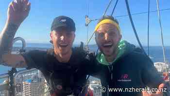 The Hits host Jono Pryor completes world's first marathon at the top of the Sky Tower - New Zealand Herald