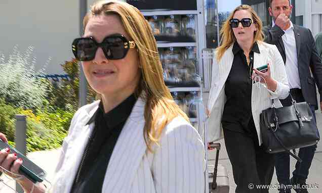 Kate Winslet looks effortlessly stylish in a black tracksuit and white pinstripe blazer - Daily Mail