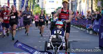Buffalo Marathon winner pushes 2-year-old in stroller for entire race, just misses world record - Buffalo News
