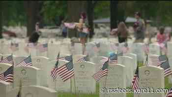 Volunteers plant nearly 200,000 flags at Fort Snelling National Cemetery