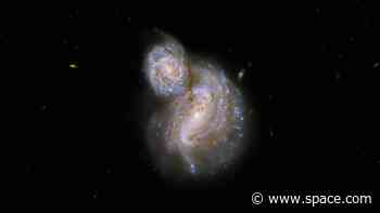 Hubble telescope snaps trippy new view of two swirling galaxies
