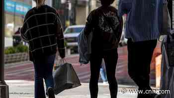 Consumers are feeling less confident about the economy, but they're still spending