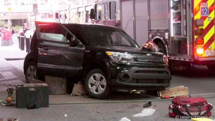 Driver suffers medical episode, girlfriend pinned under SUV in downtown Calgary crash