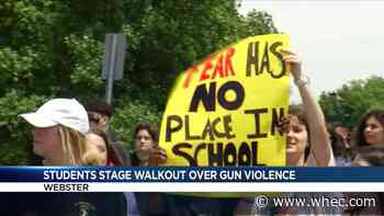 Students walk of Webster Thomas to protest gun violence
