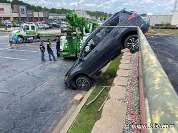 SUV crashes through Longview retaining wall after driver suffers medical episode - KLTV