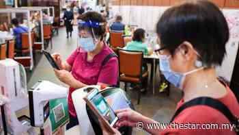 Coronavirus: Vaccine pass checks to start as Hong Kong officials find some residents using old infection records to get round rules - The Star Online