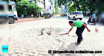‘Unscientific work’: Social activist sweeps road in protest - Times of India