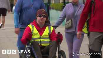 Teenager conquers Hadrian's Wall trail in wheelchair - BBC