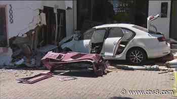 Woman allegedly steals Door Dash car, crashes into South Park building - CBS News 8
