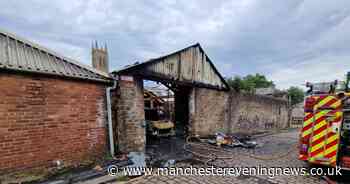 Fire crew remain at scene of huge blaze in Bolton town centre this morning - Manchester Evening News