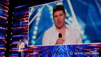 Simon Cowell shocked while watching himself perform through AI