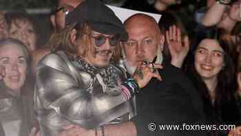 Johnny Depp mobbed by 'Happy Birthday'-singing fans on last night of UK tour with Jeff Beck