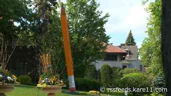Giant pencil sculpture drawing eyes at Lake of the Isles