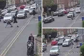 Brutal fight stops traffic in Blackburn road