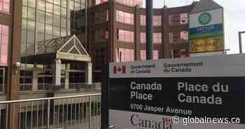 Hopeful — and tired — Albertans face long waits at Edmonton passport office