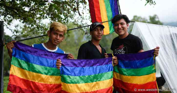 Massive Migrant Caravan Marches Toward US with LGBT Flags Flying as Mexican President Snubs Biden at Summit