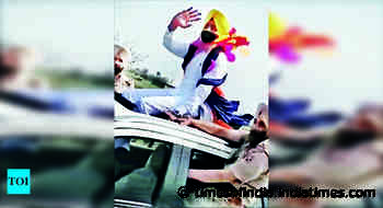 Transport min atop SUV, opp slams him - Times of India