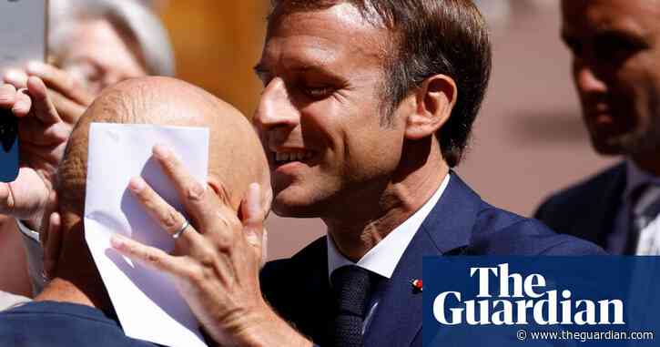 Will a kiss on the head bring victory for Emmanuel Macron?