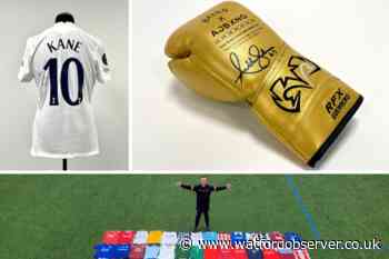 Signed Anthony Joshua glove in Spurs kit man's auction