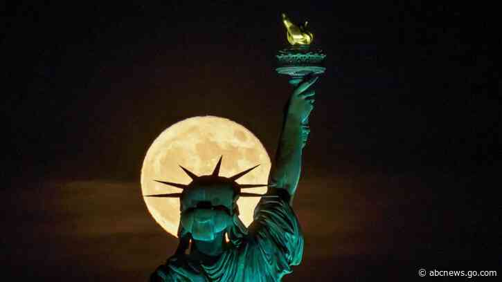 AP PHOTOS: Supermoon delights skygazers around the globe