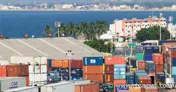 Thieves disappear with 20 shipping containers full of gold and silver ore and TVs from Mexico seaport - CBS News
