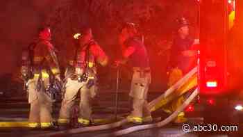 Crews battle large fire near Fresno railroad tracks