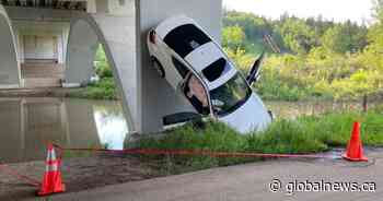 Edmonton fire, police looking into vertical car under Campbell Bridge
