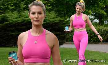 OnlyFans star Sarah Jayne Dunn shows off her toned tummy in pink sports